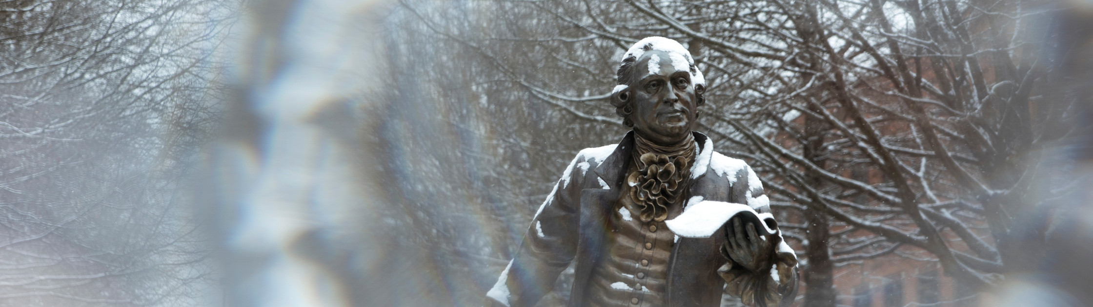 Photo of the George Mason statue in winter